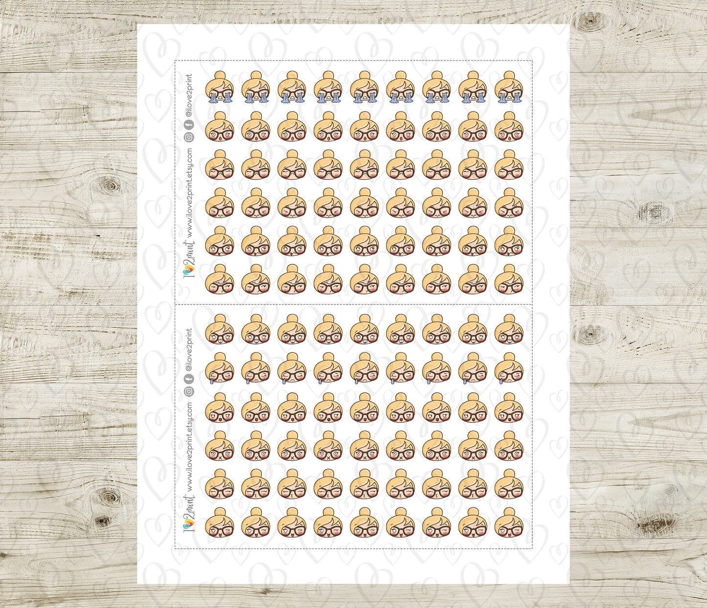 Sheet of planner stickers with a blond hair girl head design on a wooden surface