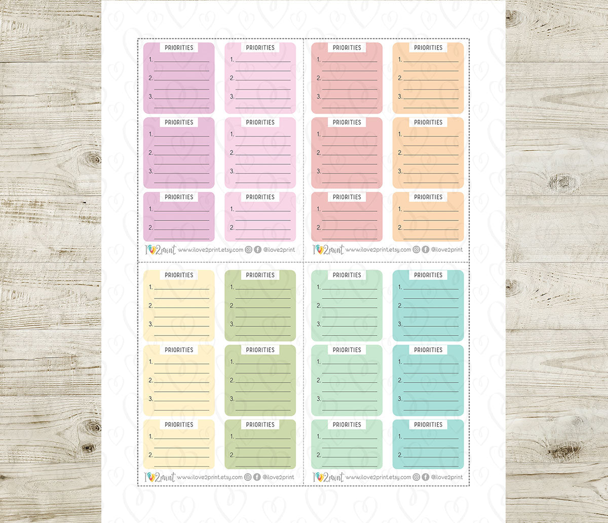 Sheet of priority labels in various pastel colors on a wooden surface