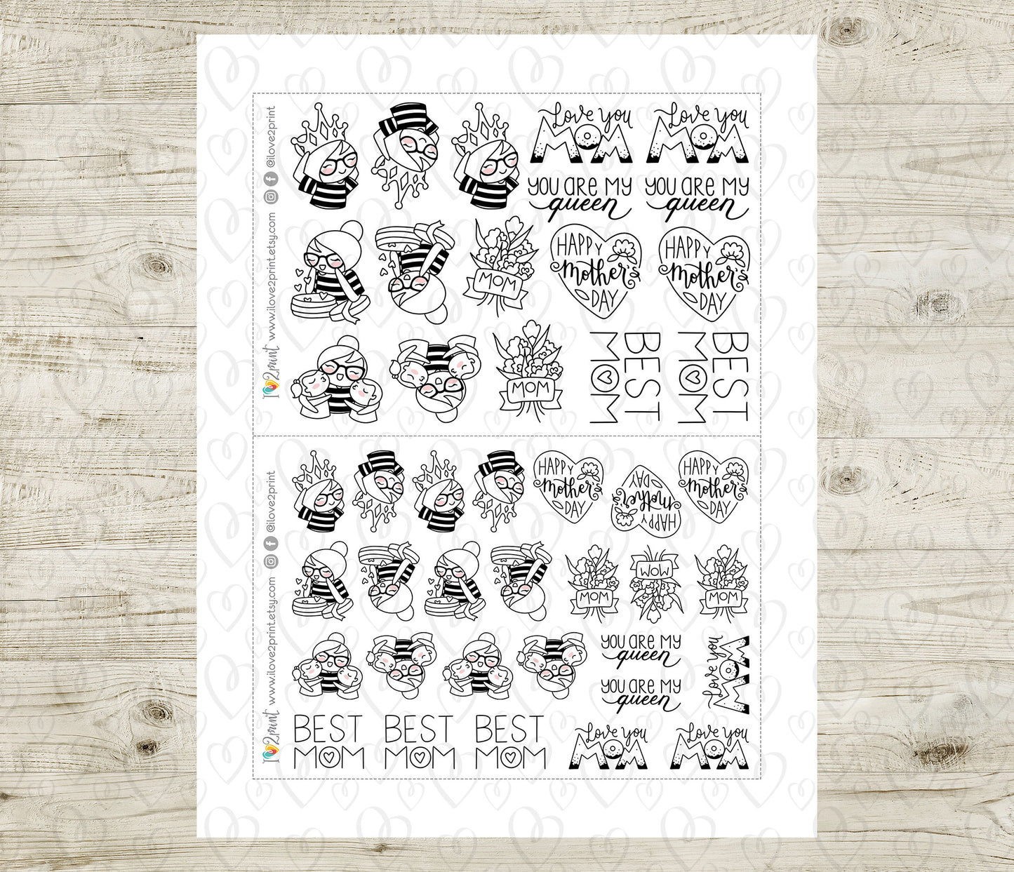 Sheet of black and white stickers with 'Mom' and heart designs on a wooden surface
