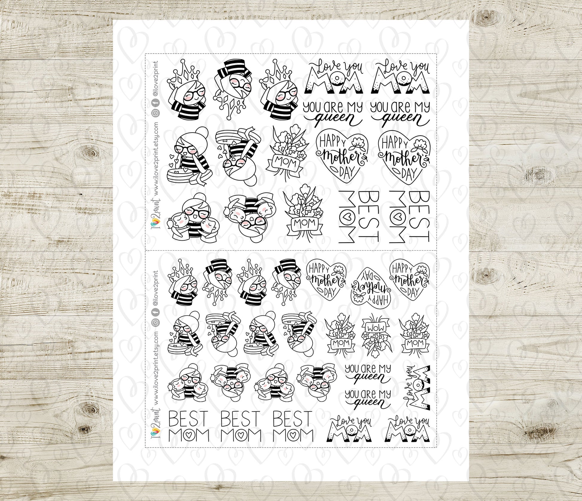 Sheet of black and white stickers with 'Mom' and heart designs on a wooden surface