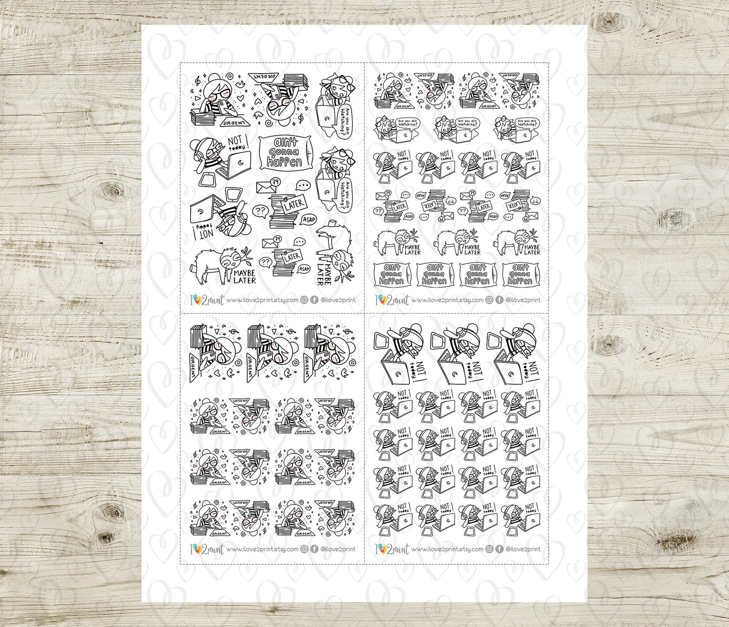 Sheet of black and white planner stickers on a wooden surface
