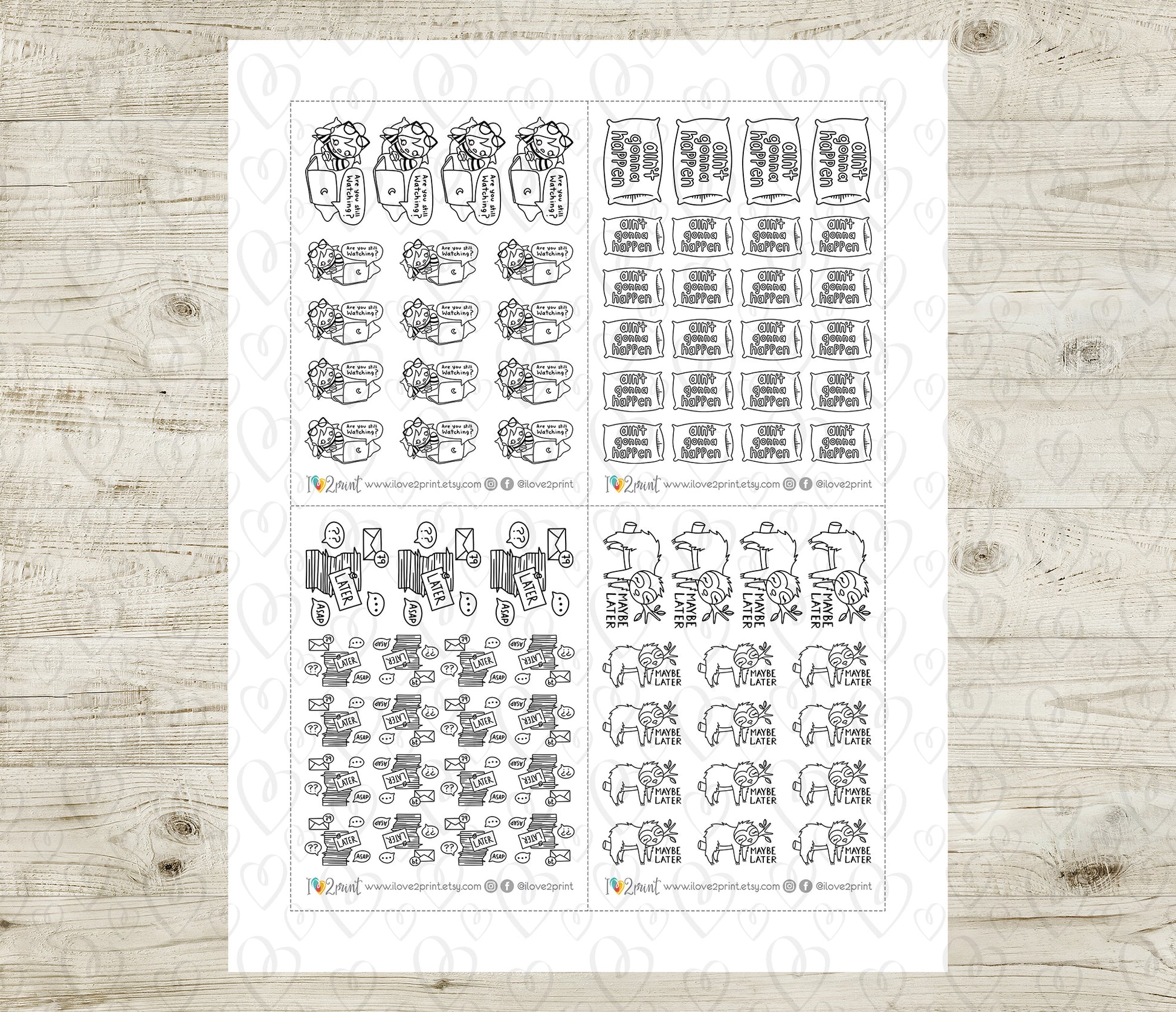 Sheet of planner stickers with various designs on a wooden surface