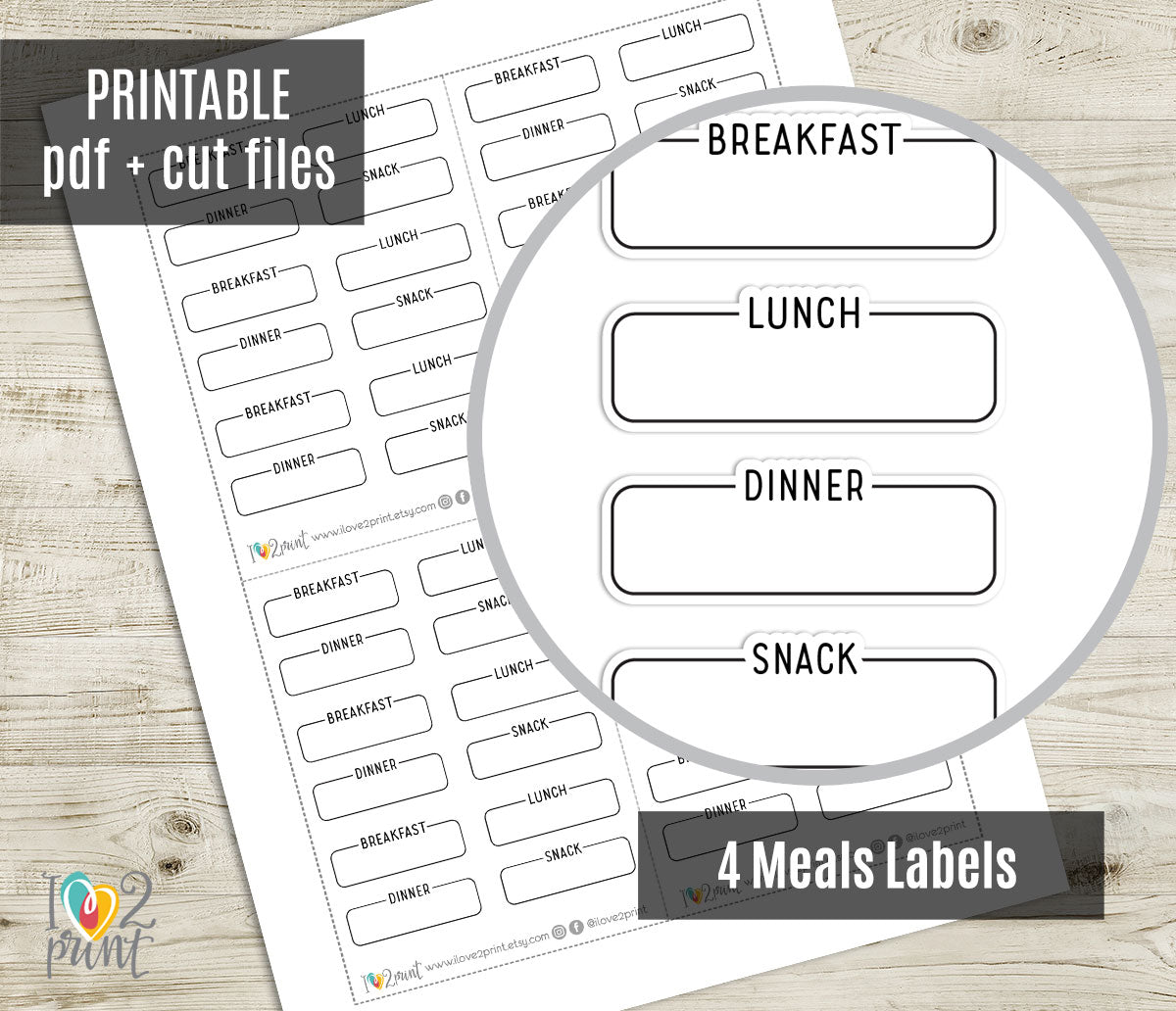 Meal label stickers for breakfast, lunch, dinner, and snack on a wooden surface.