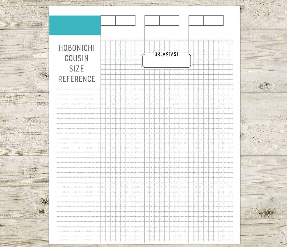 Breakfast label sticker on a Hobonichi cousin size reference sheet on a wooden surface