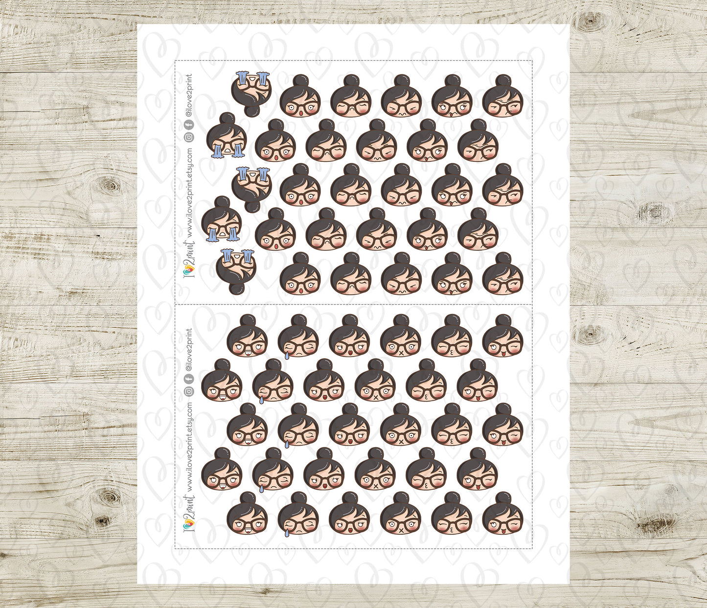 Sheet of planner stickers with a woman's face feelings design on a wooden surface