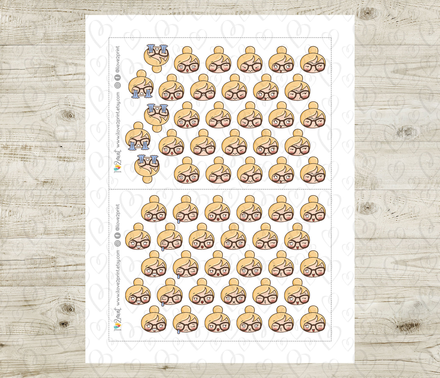 Sheet of emoji stickers with various blond hair girl face expressions on a wooden surface