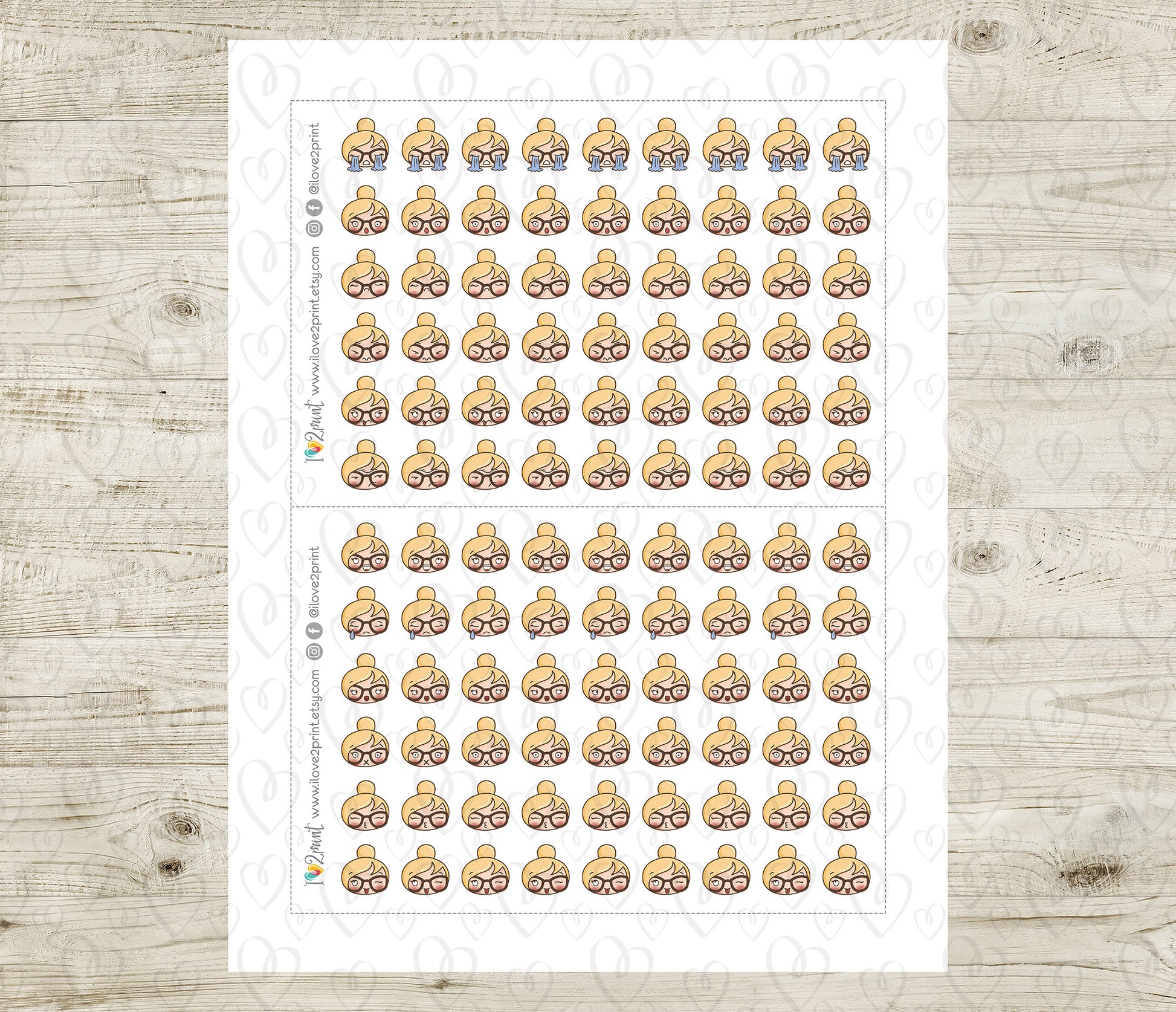 Sheet of planner stickers with a blond hair girl head design on a wooden surface