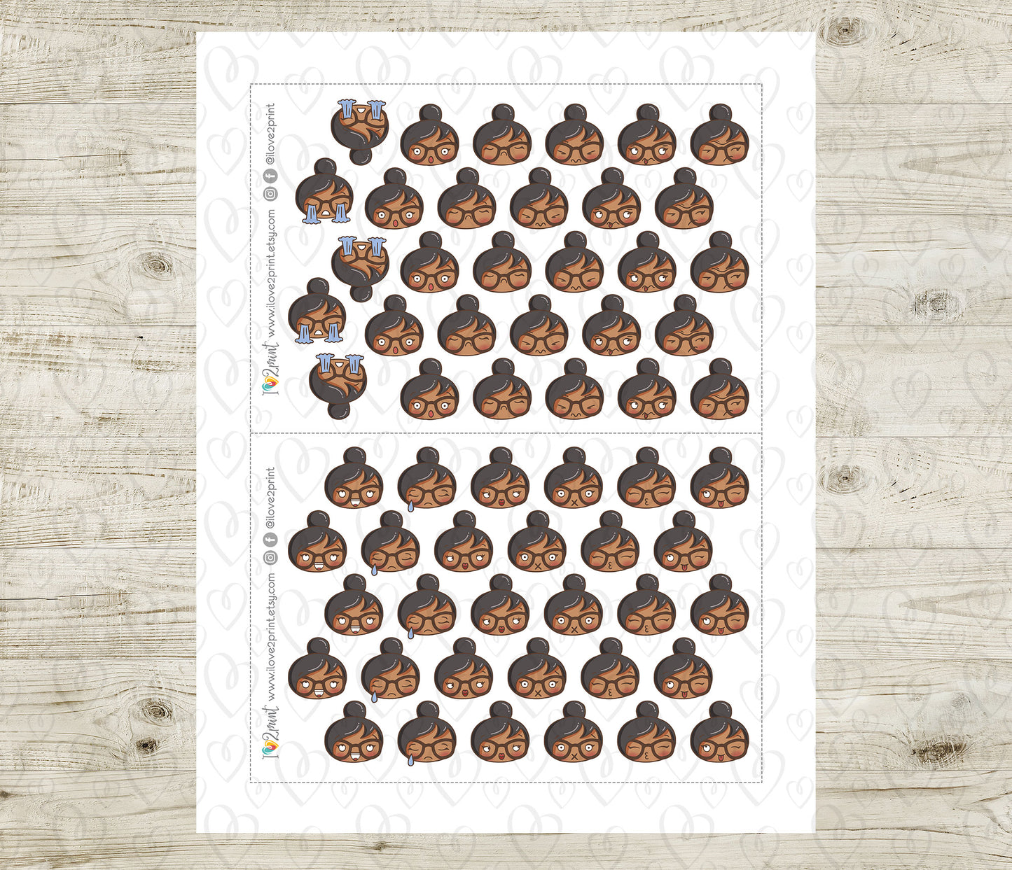 Sheet of planner stickers with a brown skin girl various moods on a wooden surface