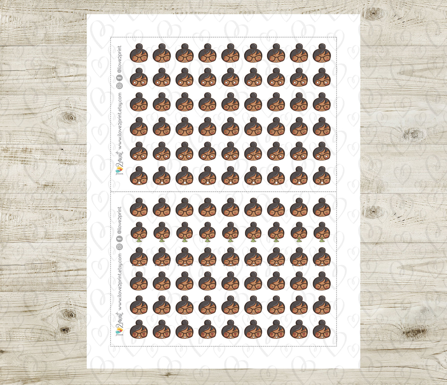 Sheet of small stickers with a person's face on a wooden surface