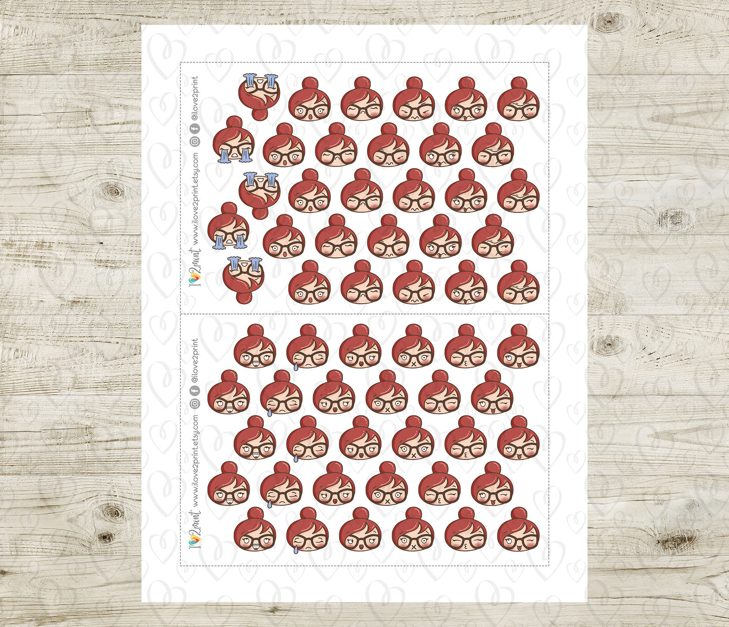 Sheet of red hair character head moods stickers on a white background with a wooden surface underneath.