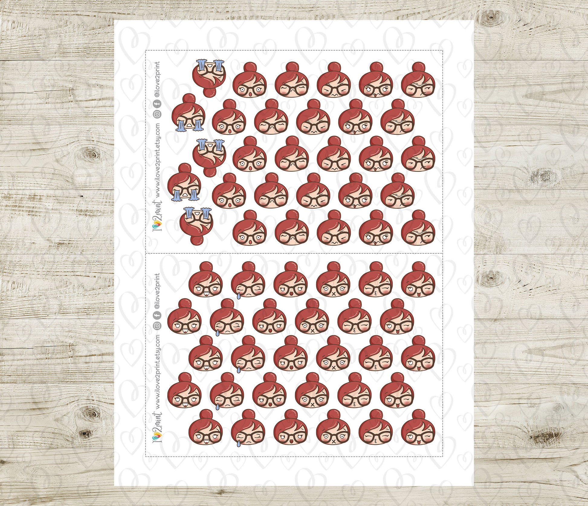 Sheet of red hair character head moods stickers on a white background with a wooden surface underneath.