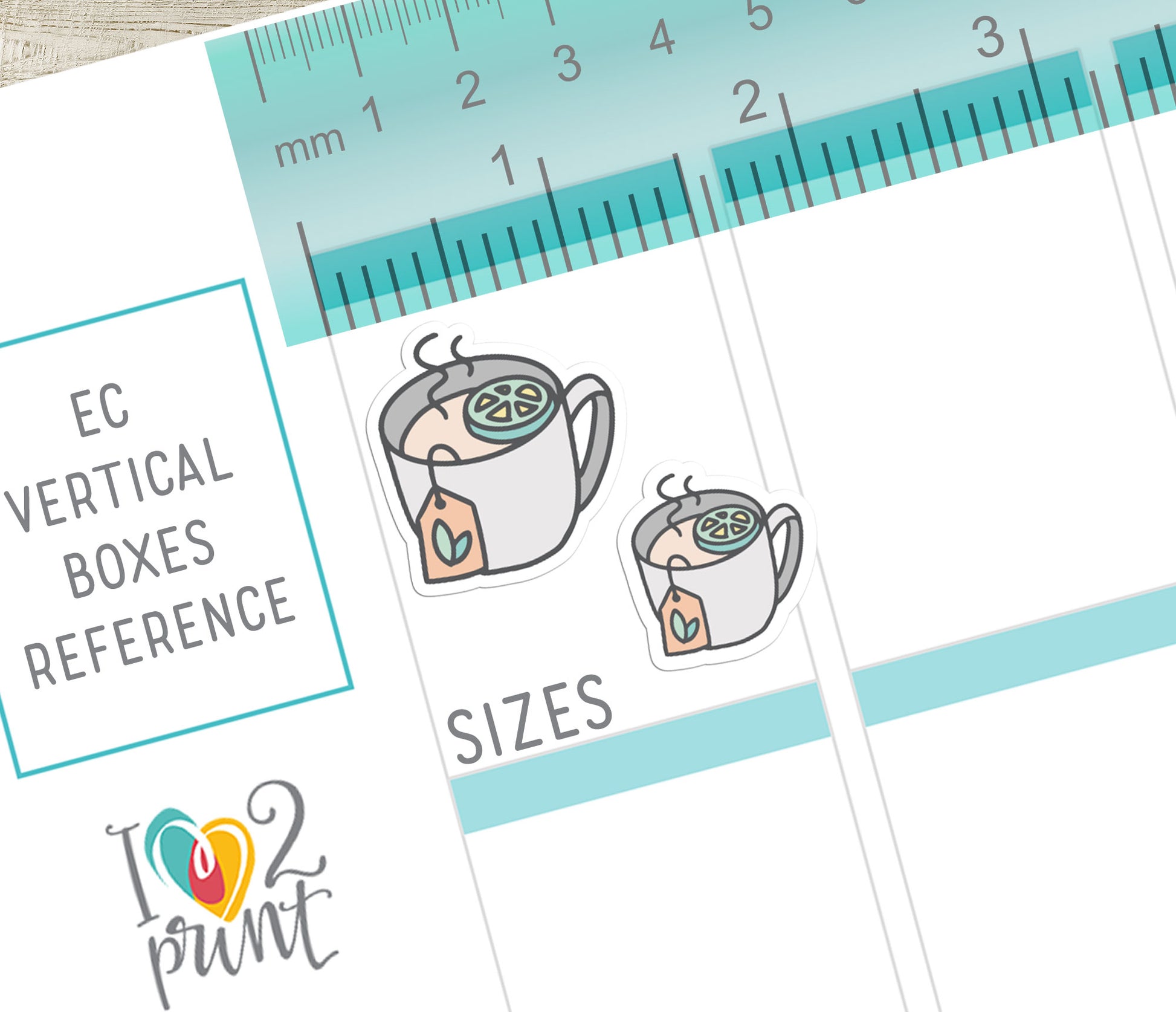 Tea-stickers comparing 2 sizes with a ruler for reference on a white background