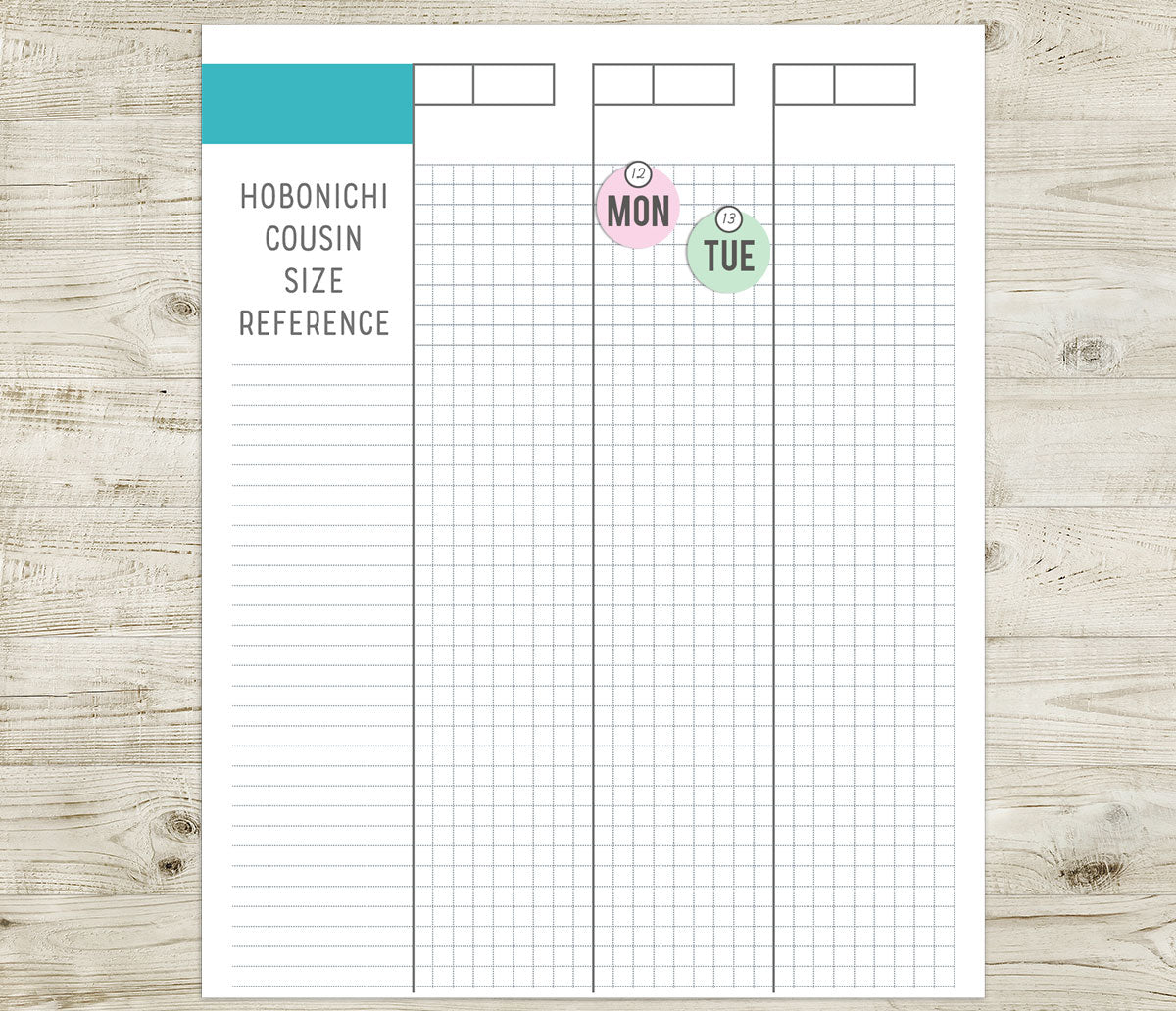 Days of the week stickers on a Hobonichi cousin size reference sheet on a wooden surface