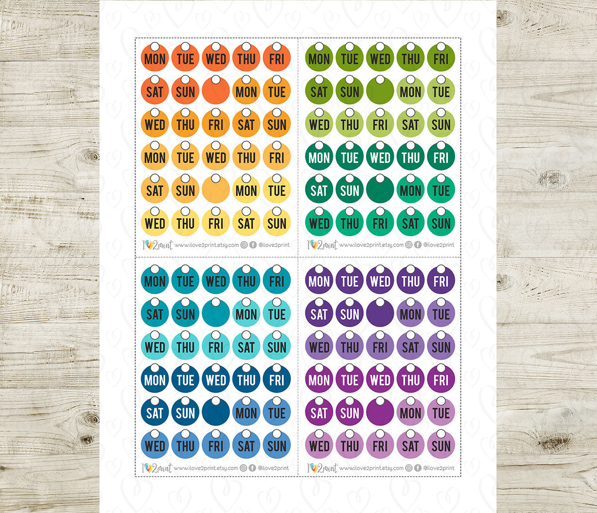 Colorful Days of the week circle planner stickers on a wooden surface
