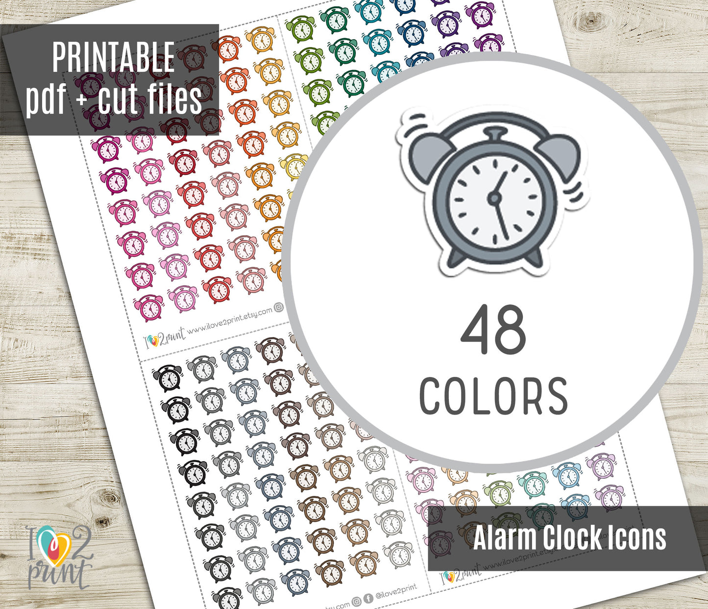 Sheet of alarm clock icons in various colors with a circular icon and text on a wooden surface.