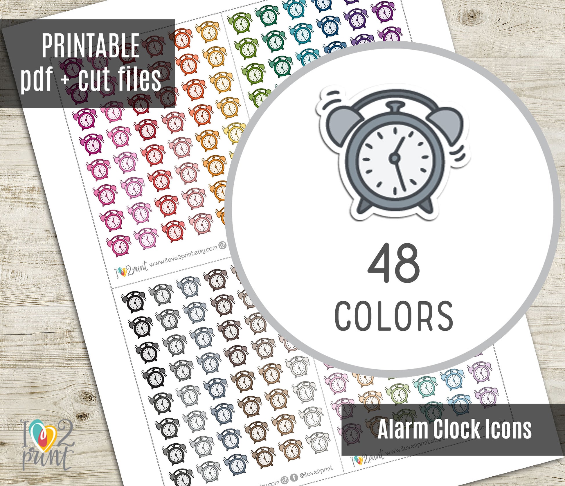 Sheet of alarm clock icons in various colors with a circular icon and text on a wooden surface.