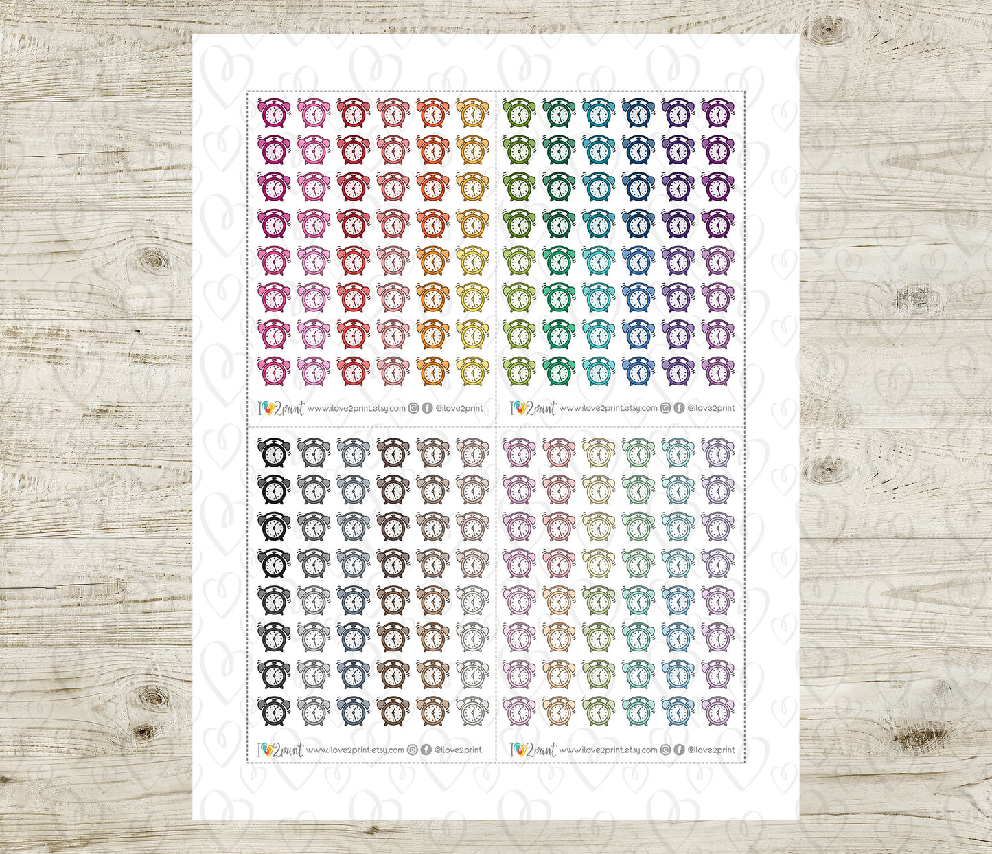 Sheet of colorful alarm clock icons on a wooden surface