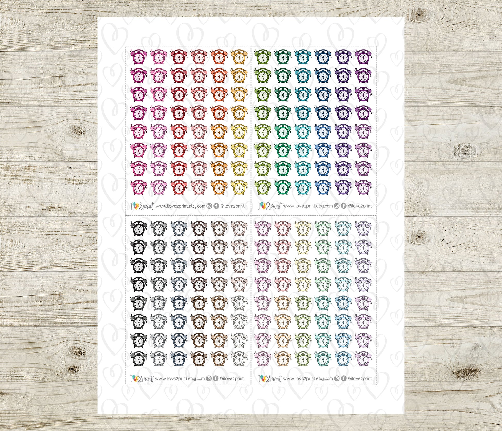 Sheet of colorful alarm clock icons on a wooden surface