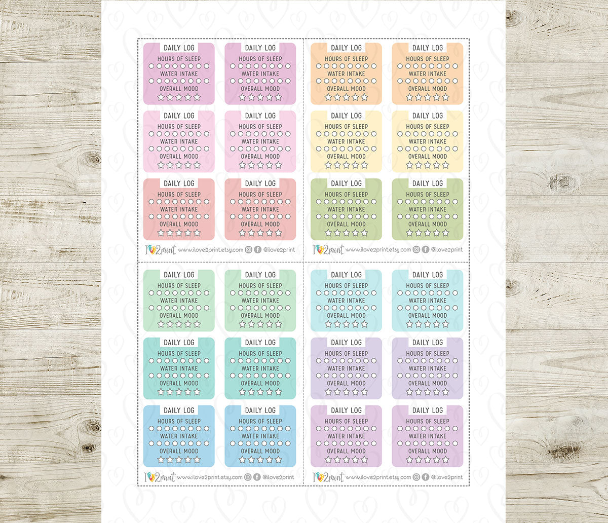 Sheet of daily log planner stickers with various colored checkboxes on a wooden surface