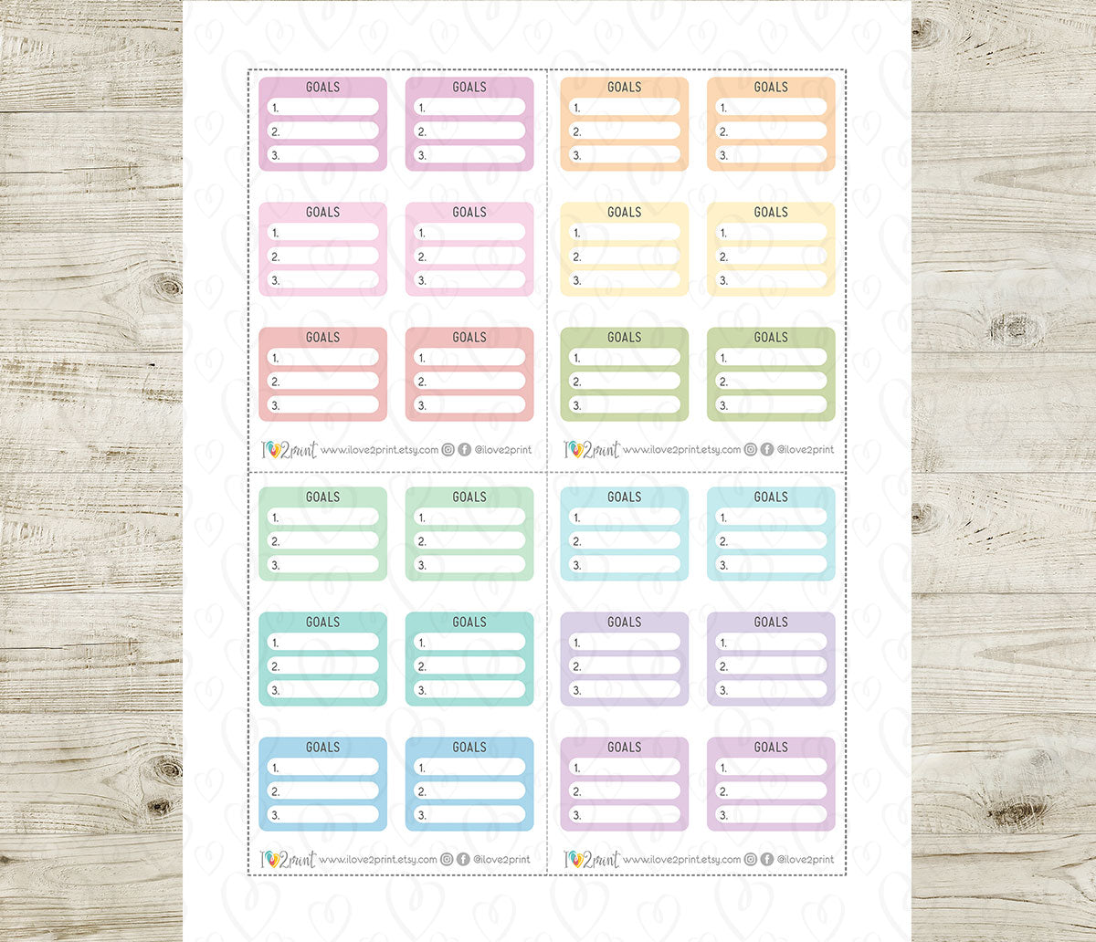 Set of colorful goal planner stickers on a wooden surface