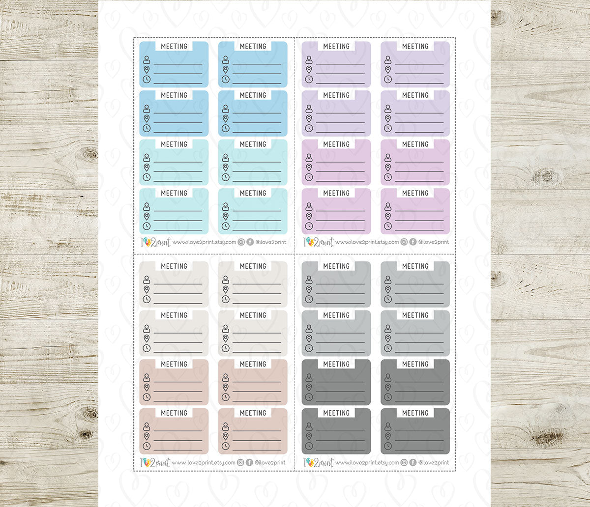 Sheet of meeting planner stickers in various colors on a wooden surface