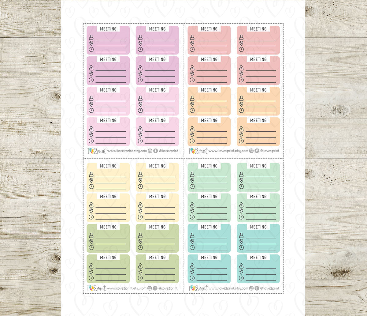 Colorful meeting planner stickers on a wooden surface