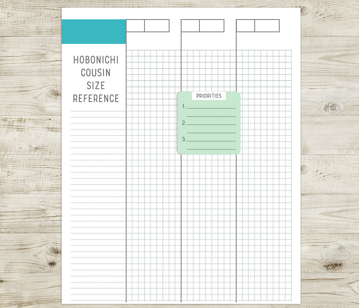 Hobonichi cousin size reference sheet with grid and priority list sticker on a wooden surface