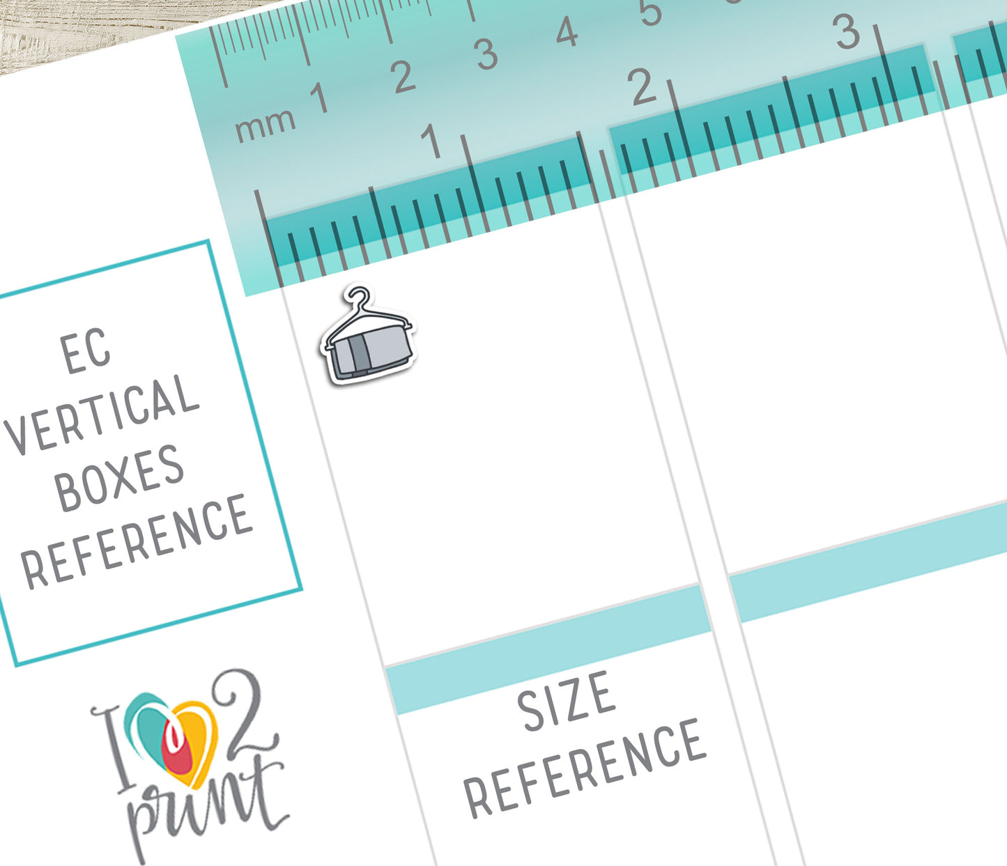 Vertical Planner measurement sheet with ruler and text for size reference, featuring a towel sticker