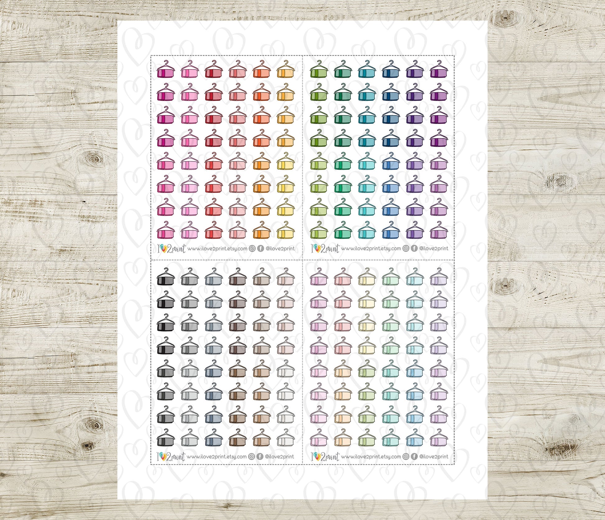 Sheet of colorful hanging towel icons stickers on a wooden surface