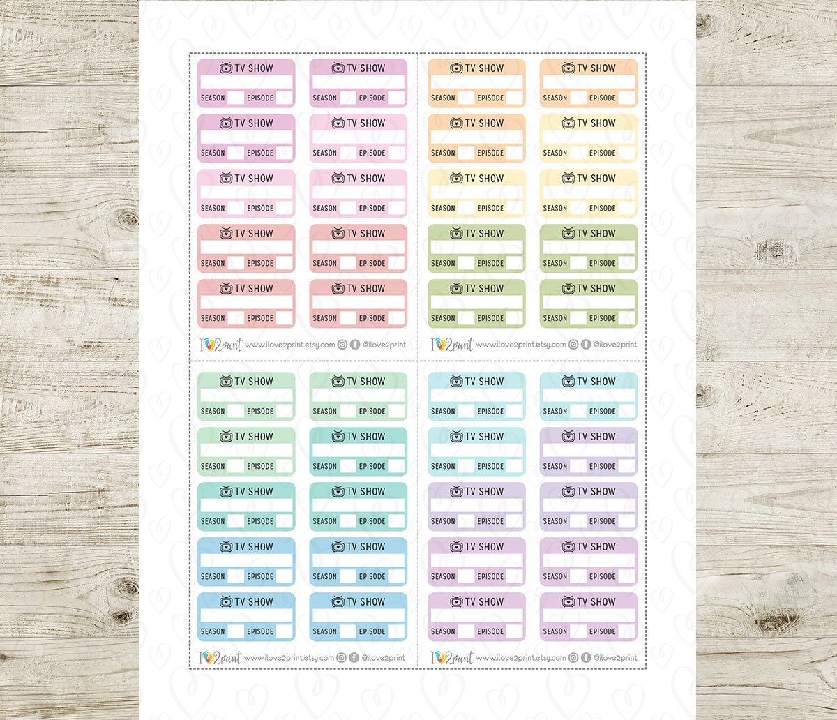 Sheet of planner stickers with pastel TV show labels on a wooden surface