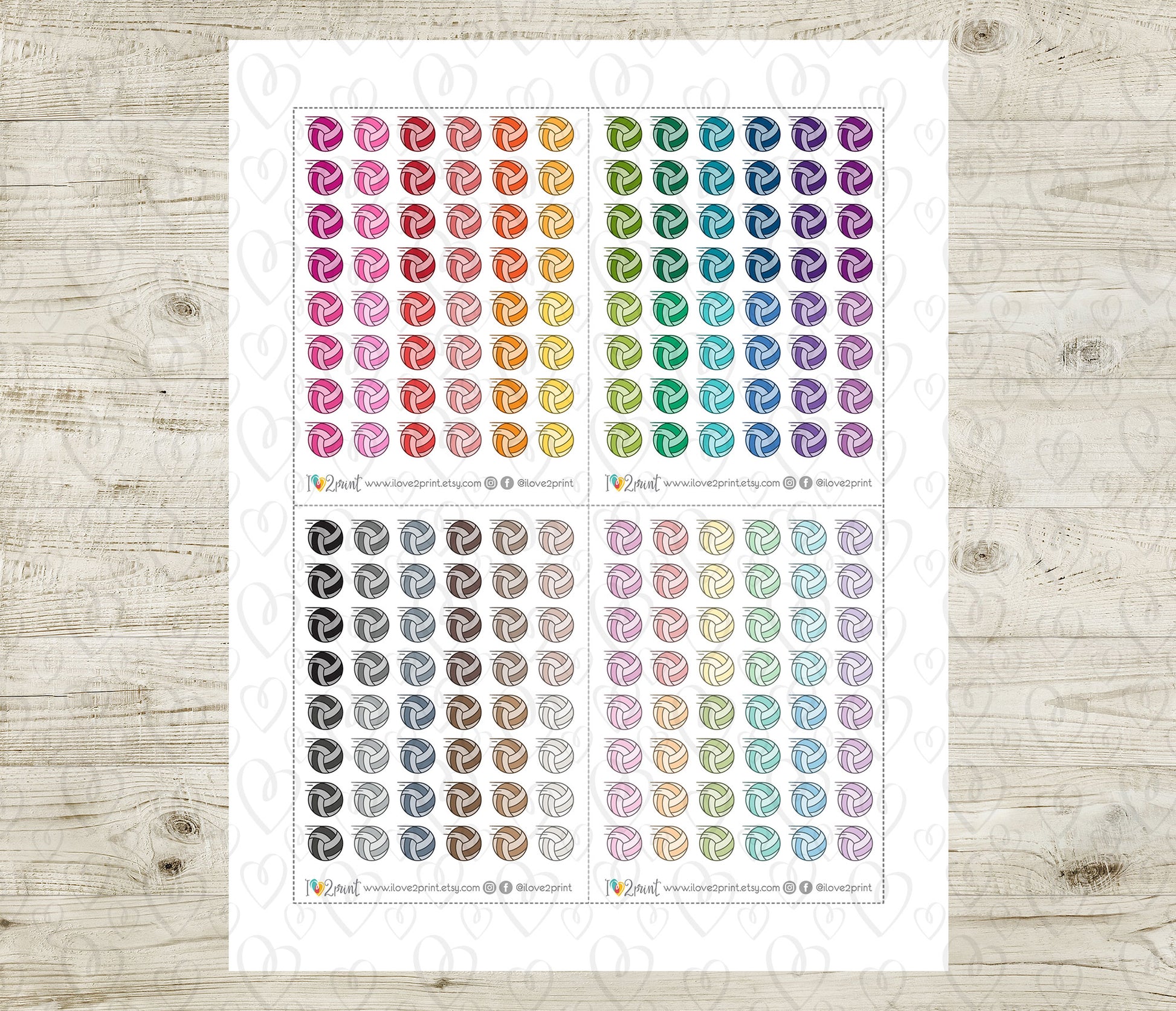 Sheet of colorful voley ball stickers on a wooden surface