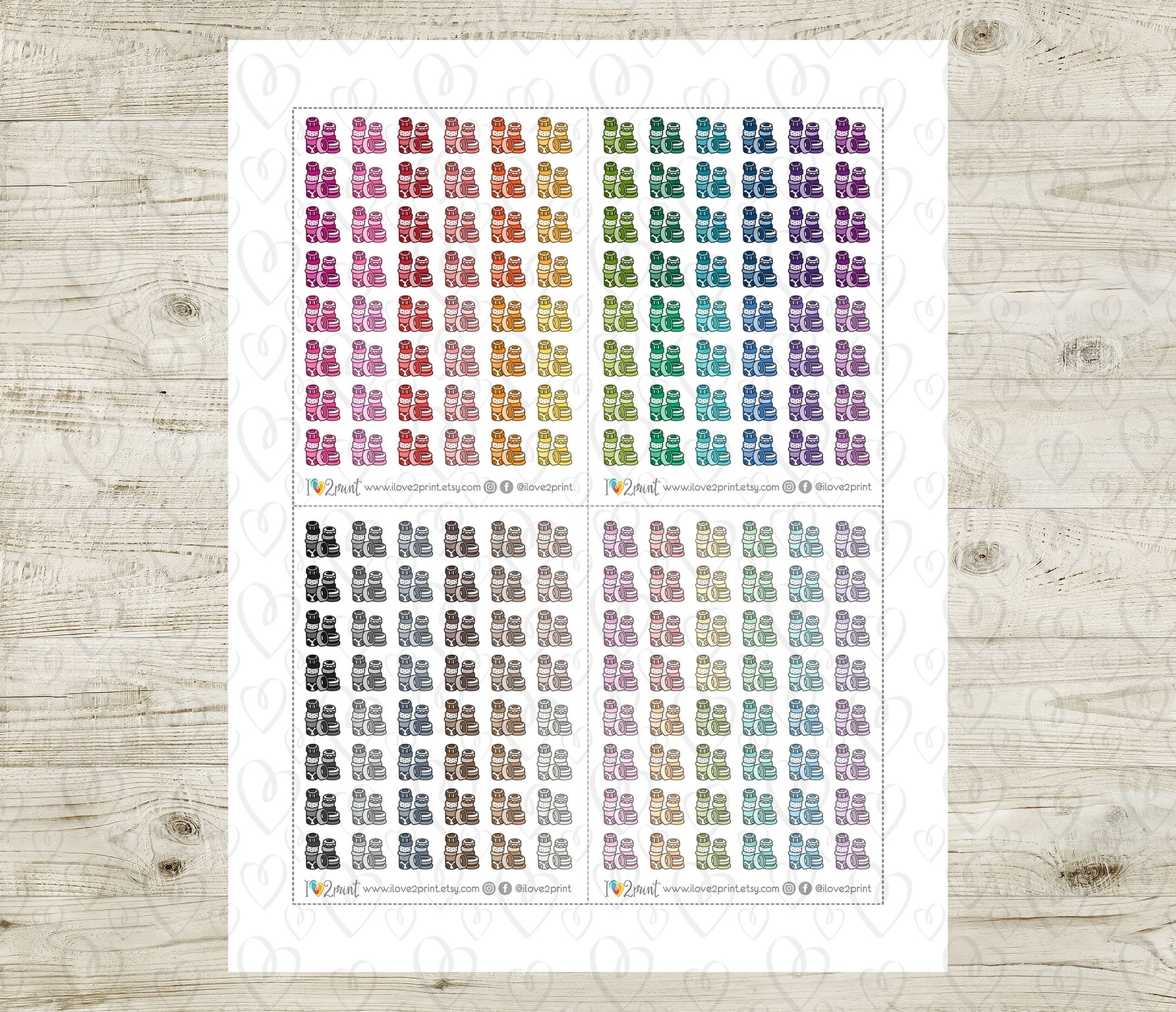 Sheet of planner stickers with various colorful washi tape pile on a wooden surface